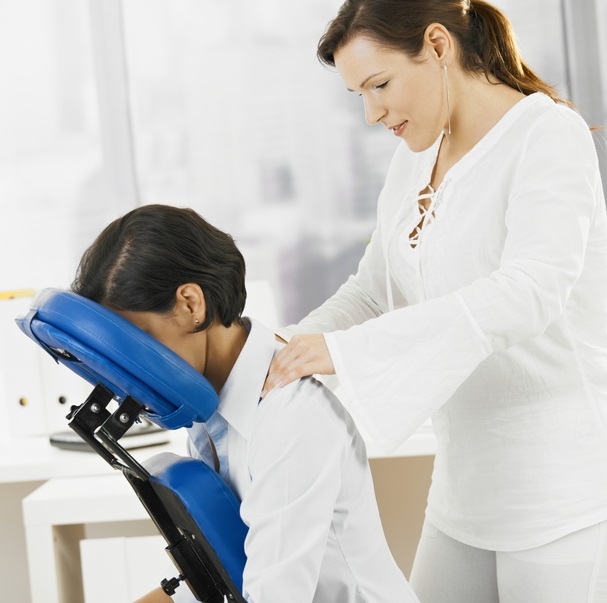 A professional woman receiving a chair massage